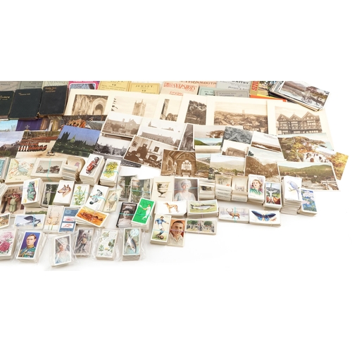 2254 - A mixed group of ephemera to include various cigarette card sets, photographic holiday souvenir phot... 