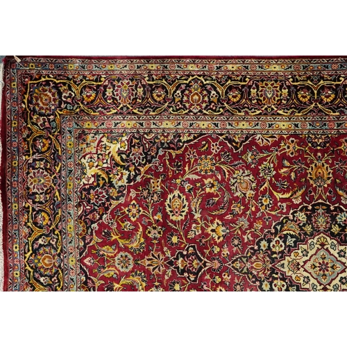 1032 - A Kashaan silk rug, 20th century, the midnight blue field with a central stylized medallion flanked ... 