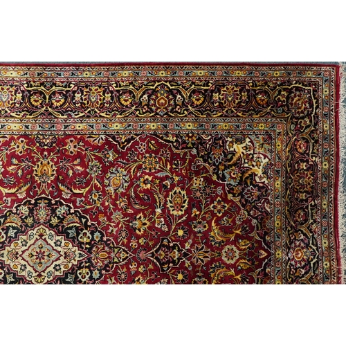 1032 - A Kashaan silk rug, 20th century, the midnight blue field with a central stylized medallion flanked ... 