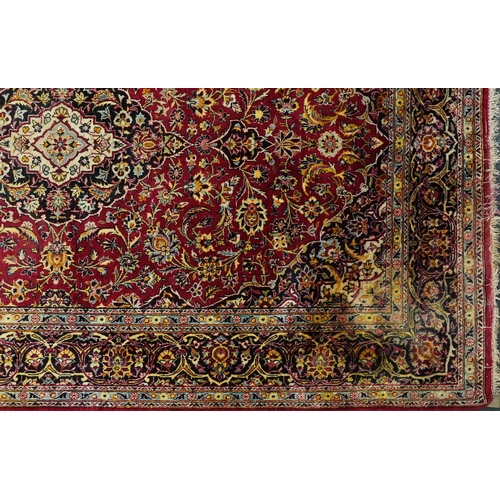 1032 - A Kashaan silk rug, 20th century, the midnight blue field with a central stylized medallion flanked ... 