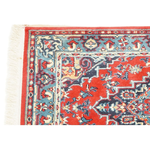 1031 - A Turkomen rug, late 20th century, the red field with a central stepped medallion, 143cm x 90cm, tog... 