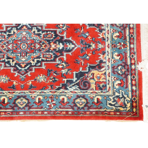 1031 - A Turkomen rug, late 20th century, the red field with a central stepped medallion, 143cm x 90cm, tog... 