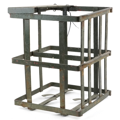 2538 - A military interest painted steel bomb cage, 48cm H x 38cm W x 38cm D.