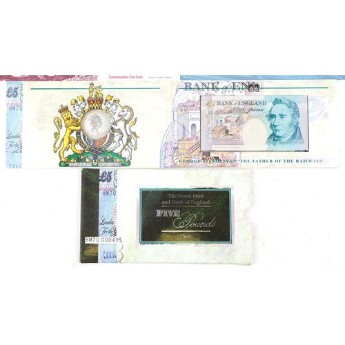 2194 - British five pound note and coin sets to include a five pound note serial number HM70-000495, the HM... 