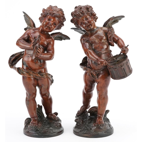 68 - A pair of 20th century brown patinated bronze figures of cherubs playing drums and cymbals, each sig... 