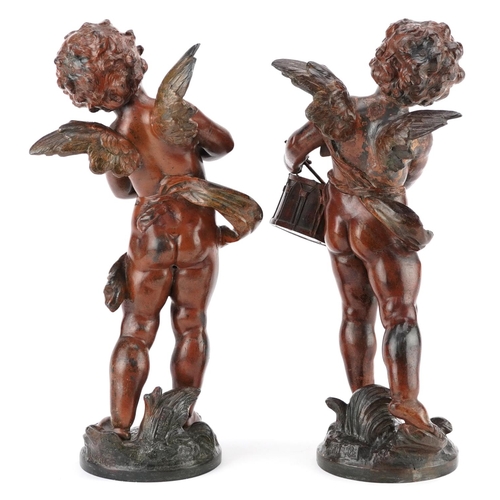 68 - A pair of 20th century brown patinated bronze figures of cherubs playing drums and cymbals, each sig... 