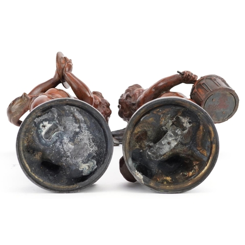 68 - A pair of 20th century brown patinated bronze figures of cherubs playing drums and cymbals, each sig... 