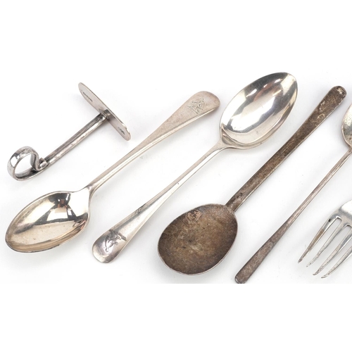 469 - Silver objects including two Arts & Crafts silver spoons and sugar tongs, the largest 13cm in length... 