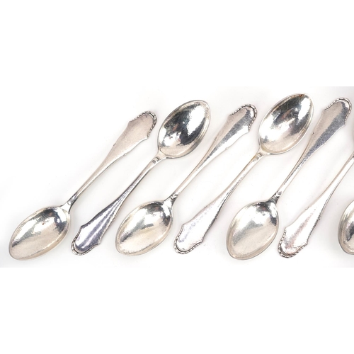 416 - Svend Toxvaerd, a set of ten Danish silver desert spoons, 17cm in length, total 379.0g.