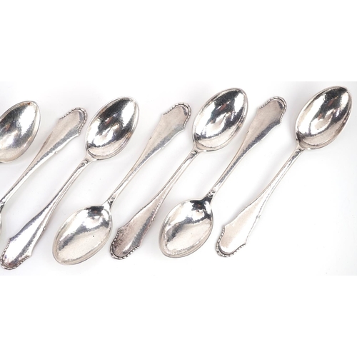 416 - Svend Toxvaerd, a set of ten Danish silver desert spoons, 17cm in length, total 379.0g.