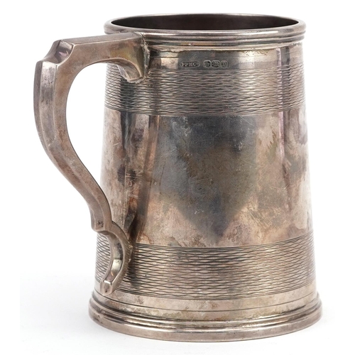 393 - Peerless Plate Manufacturing Co. Ltd, George V engine turned silver tankard with presentation inscri... 