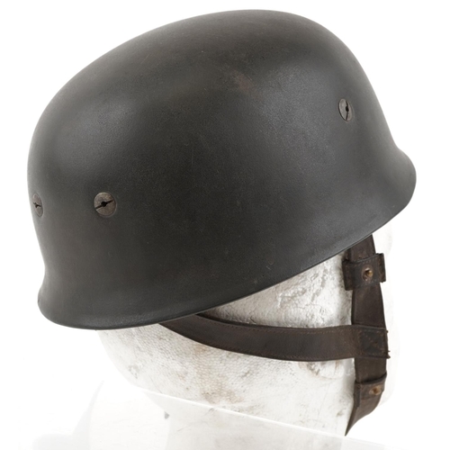 2592 - German military World War II Fallschirmjäger tin helmet with liner and chin strap.