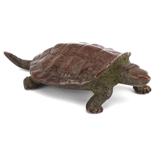 116 - A Japanese patinated bronze okimono of a tortoise, impressed marks to the base, 5.5cm in length.