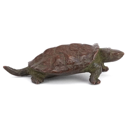 116 - A Japanese patinated bronze okimono of a tortoise, impressed marks to the base, 5.5cm in length.