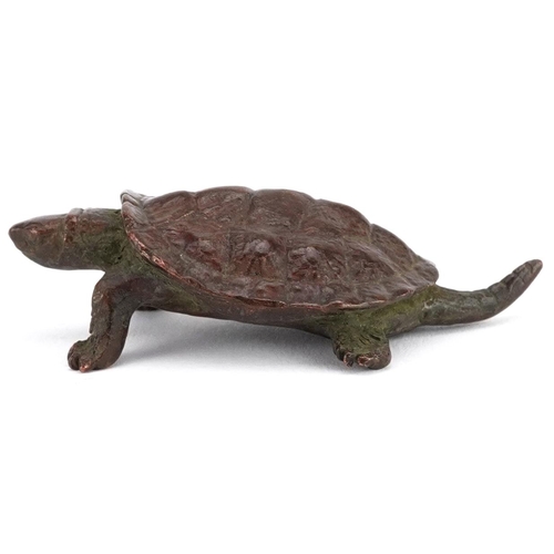 116 - A Japanese patinated bronze okimono of a tortoise, impressed marks to the base, 5.5cm in length.