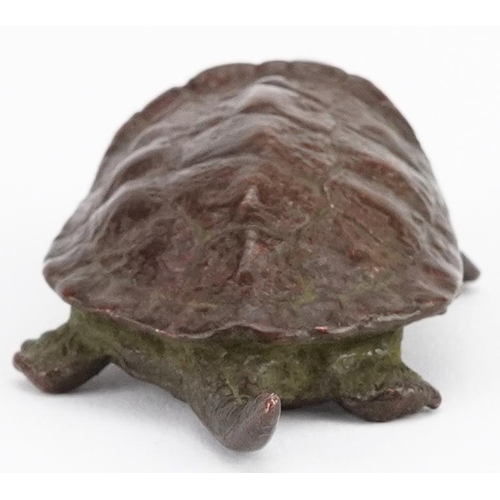 116 - A Japanese patinated bronze okimono of a tortoise, impressed marks to the base, 5.5cm in length.