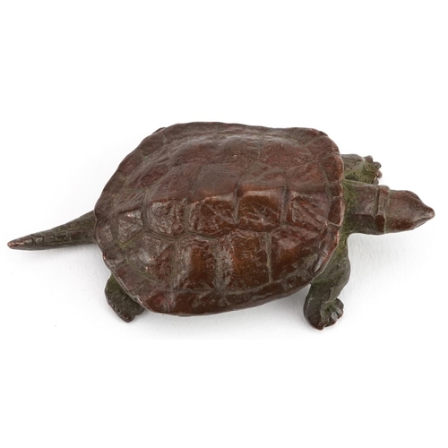 116 - A Japanese patinated bronze okimono of a tortoise, impressed marks to the base, 5.5cm in length.