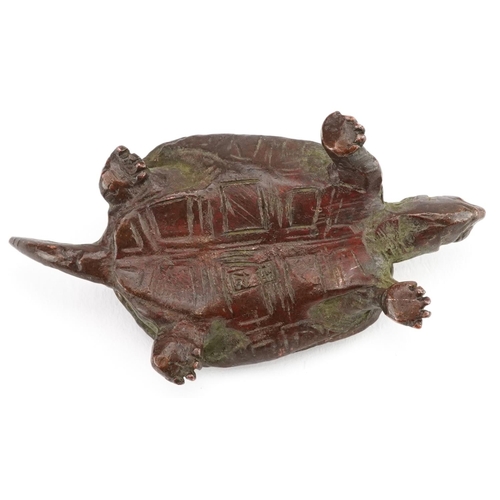 116 - A Japanese patinated bronze okimono of a tortoise, impressed marks to the base, 5.5cm in length.