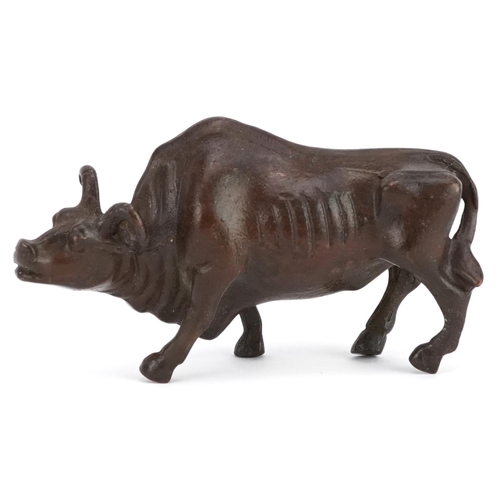 117 - A Japanese patinated bronze study of a wildebeest, 7.5cm in length.