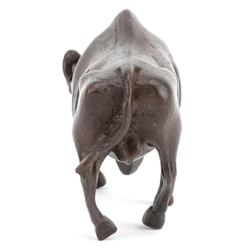 117 - A Japanese patinated bronze study of a wildebeest, 7.5cm in length.