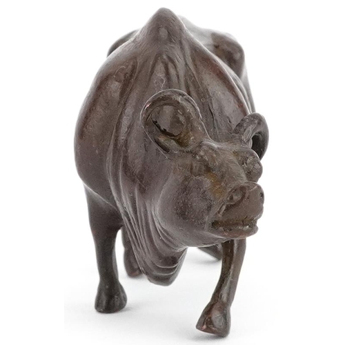 117 - A Japanese patinated bronze study of a wildebeest, 7.5cm in length.