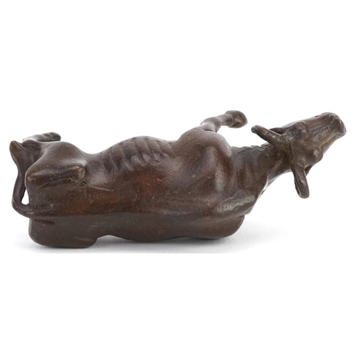 117 - A Japanese patinated bronze study of a wildebeest, 7.5cm in length.