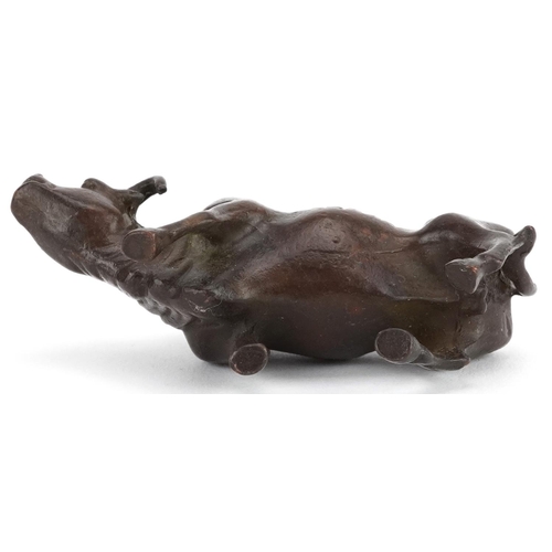 117 - A Japanese patinated bronze study of a wildebeest, 7.5cm in length.