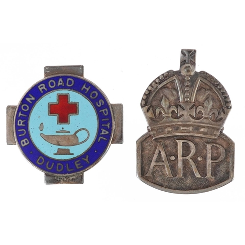 2436 - A military interest silver ARP cap badge and silver enamel Dudley Burton Road Hospital badge, the la... 