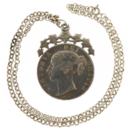 2050 - A Queen Victoria 1844 silver crown mounted into a pendant with a silver chain, the chain 48cm in len... 