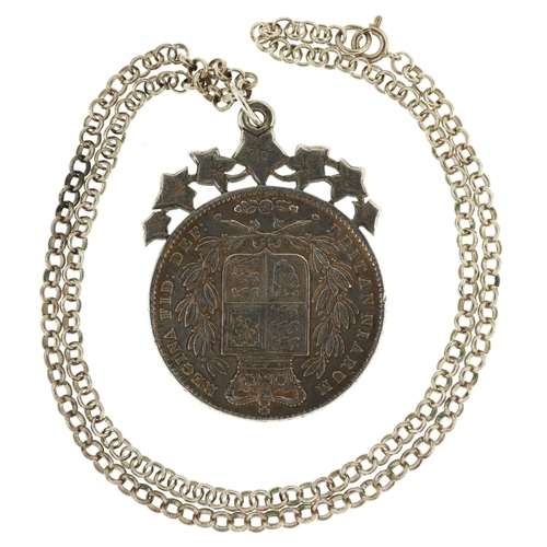 2050 - A Queen Victoria 1844 silver crown mounted into a pendant with a silver chain, the chain 48cm in len... 