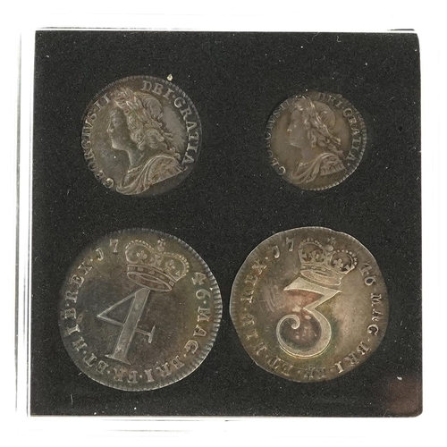 2060 - A 1746 George II silver Maundy money set comprising four coins housed in a black plastic case.