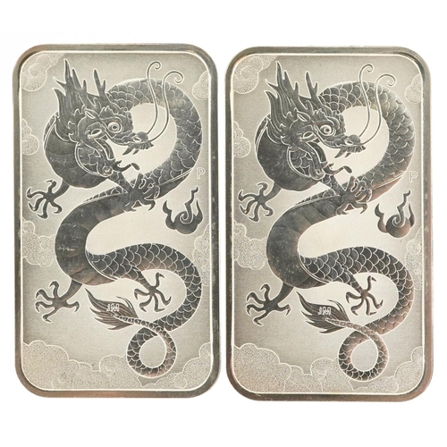 2083 - Two Australia 2019 fine silver ingots, each weighing one ounce and having a dragon to the reverse.