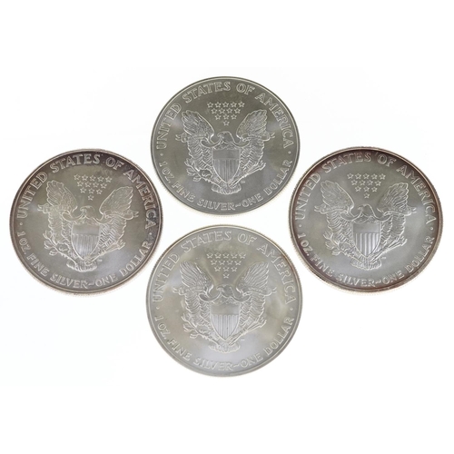 2078 - Four American one ounce fine silver Walking Liberty dollars dates 2002, 2003, 2005 and 2007.