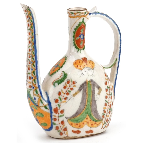 51 - A Turkish Ottoman Kütahya water jug decorated with figures, 23cm high.