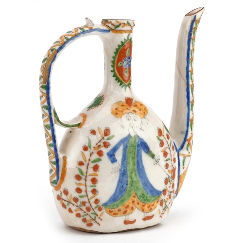 51 - A Turkish Ottoman Kütahya water jug decorated with figures, 23cm high.