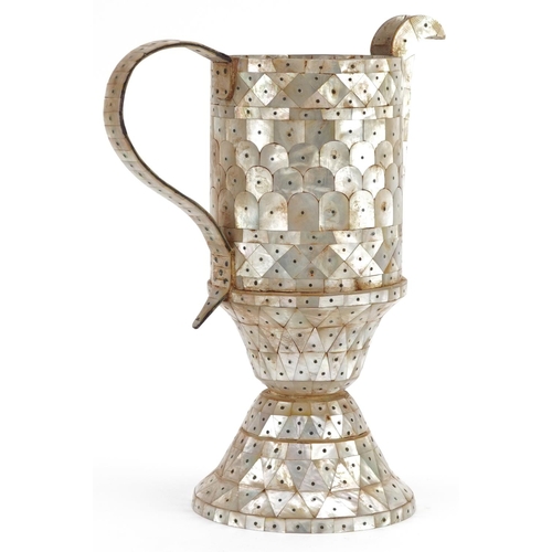 196 - An Indian mother-of-pearl Goa wine jug, 27cm high.