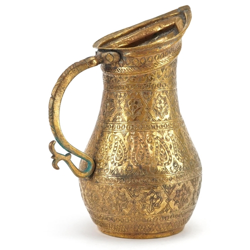 56 - A Turkish Ottaman tombak copper water jug with gilt decoration, 16cm high.