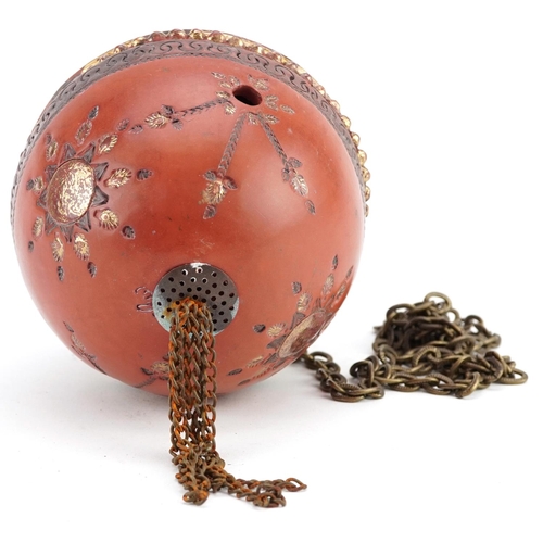 121 - A Turkish Ottoman Tophane hanging ball with gilded decoration, 14cm high.