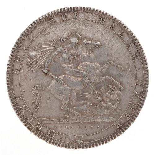 2037 - A George III 1818 silver crown with script to the edge ending in LIX.