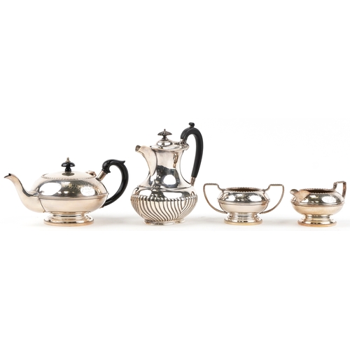 1436 - A plated three piece tea set together with a similar plated coffee pot.