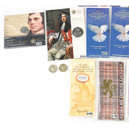 2182 - A quantity of decimal coinage in presentation packs and folders to include pound coins, two pound co... 