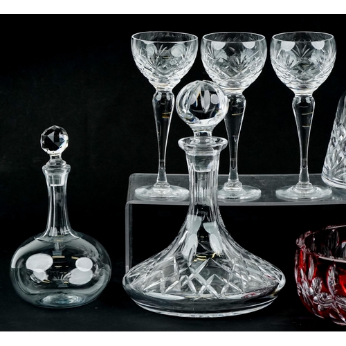 1498 - A group of cut glassware including two ship's decanters and six goblets, the largest 32cm high.