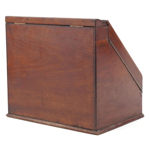 141 - A Victorian walnut stationary cabinet, the sloped front revealing division and two ink wells, H-34cm... 