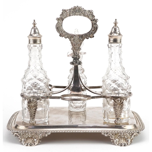 387 - Robert Hennell, a William IV silver six bottle cruet stand with three cut glass bottles, 23cm high, ... 