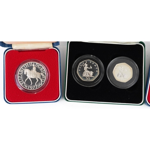 2125 - Four British silver proof coins to include a 1997 United Kingdom fifty pence two coin set and two 19... 