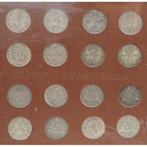 2104 - A collection of George V silver threepence pieces housed in a plastic display case.