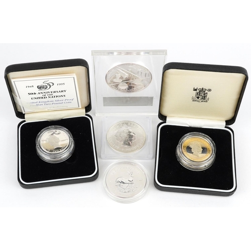 2109 - Four silver coins and an Isaac Newton fine silver proof medal, a Britannia 2000 one ounce fine silve... 