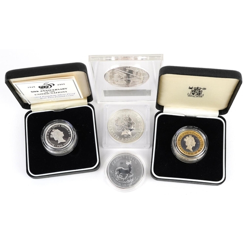 2109 - Four silver coins and an Isaac Newton fine silver proof medal, a Britannia 2000 one ounce fine silve... 