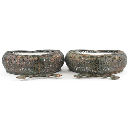 1565 - A pair of ornate bronzed metal love heart candleholders with glass panels, each 53cm high.