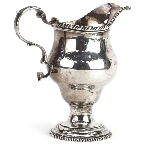 443 - A George III silver cream jug, London 1772, worn marks, H-11cm, 126g.